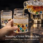 Stunning crystal whiskey set with decanter and glasses being poured on a dark background.