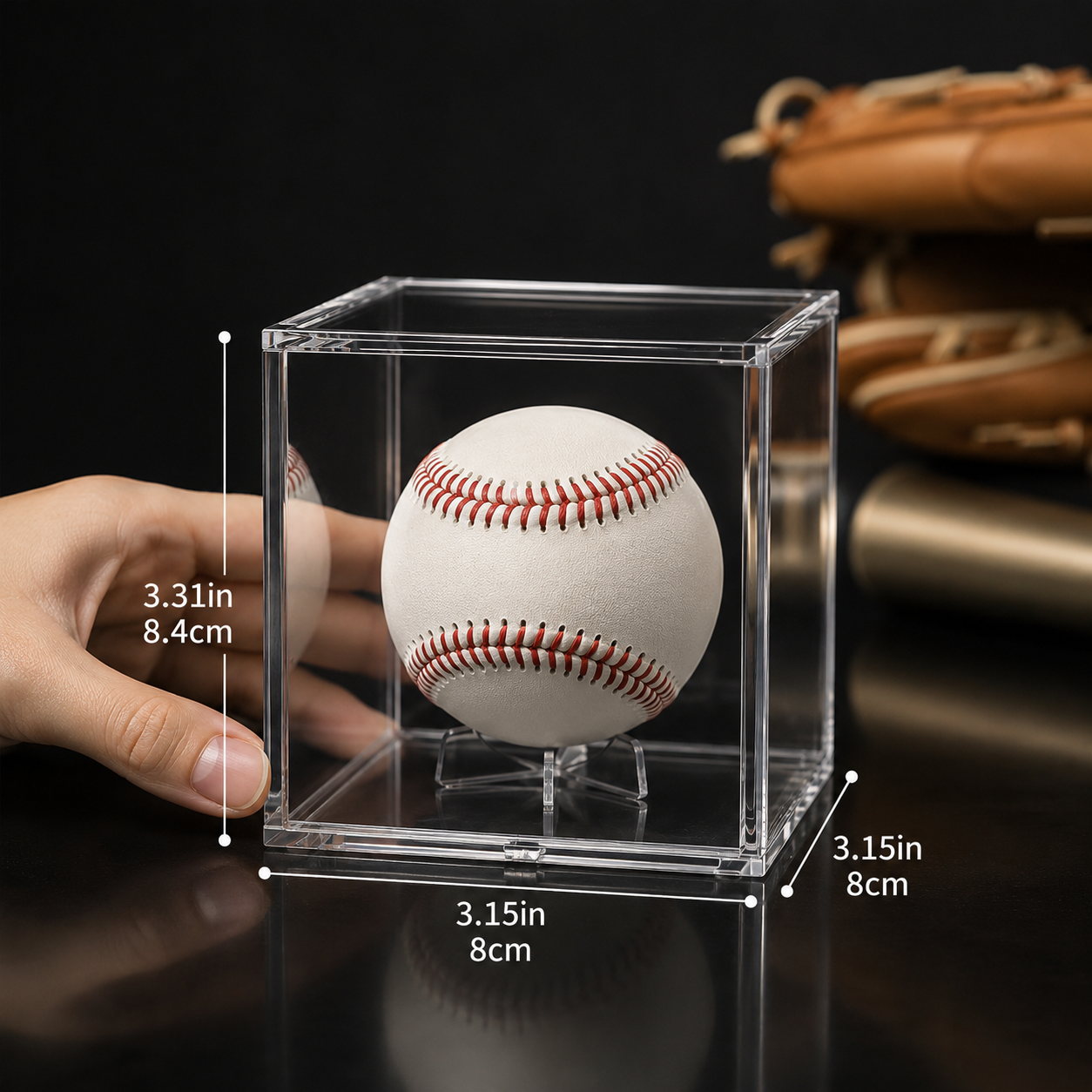 Baseball in a clear display case with dimensions indicated, against a dark background.