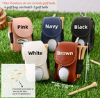 Golf ball holders in various colors on grass with golf balls and tees included.