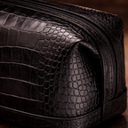 Close-up of croc-effect leather texture on men's toiletry bag
