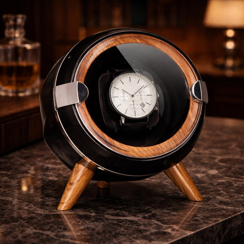 Watch winder with a watch inside on a marble surface