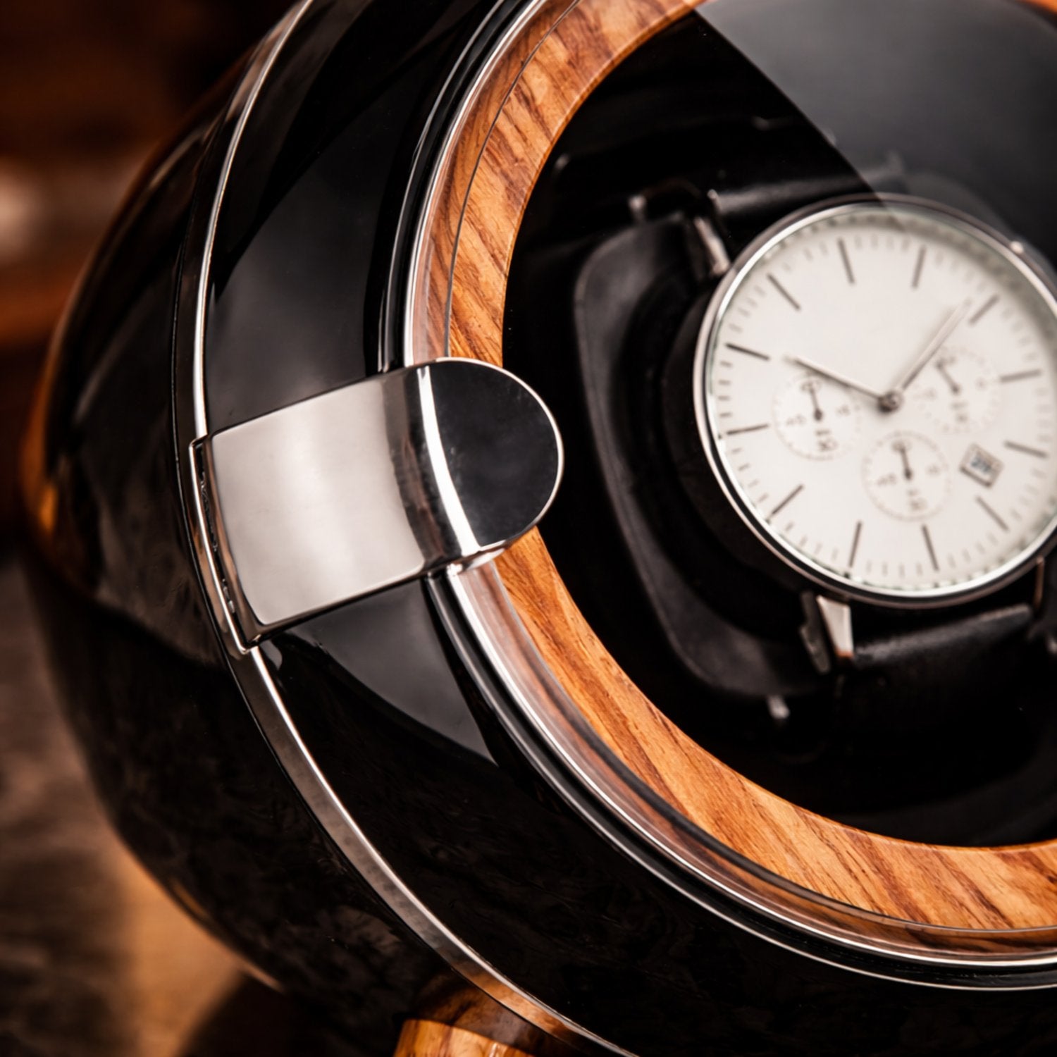 Watch inside a wooden watch winder 