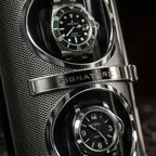watch winder
Two watches in a metallic display case with 'Signature' branding.