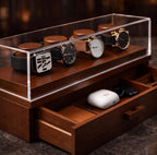 Wooden jewelry box with transparent lid displaying watches .