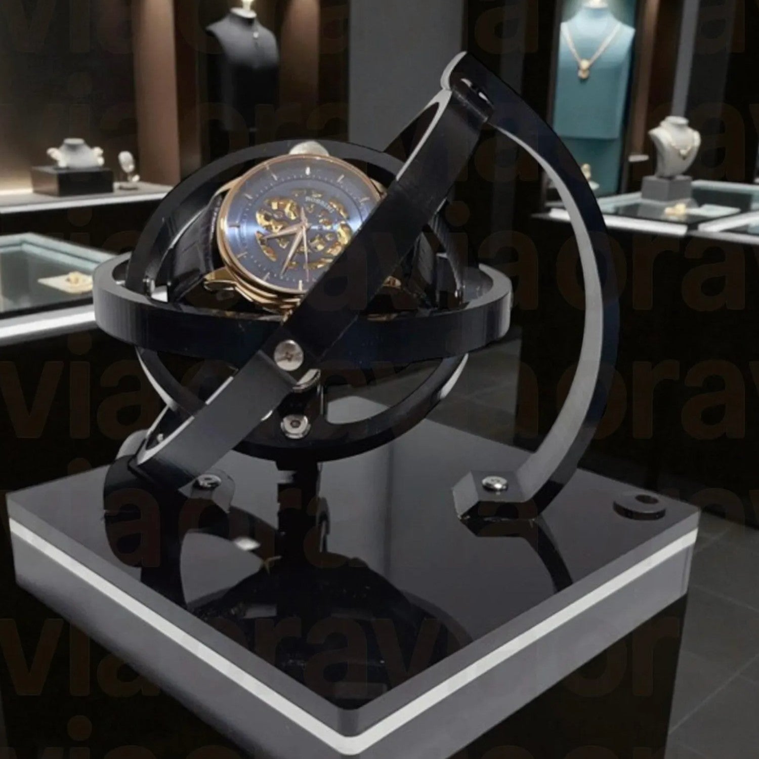 Luxury watch  winder on a black metal stand with a blurred jewelry store background